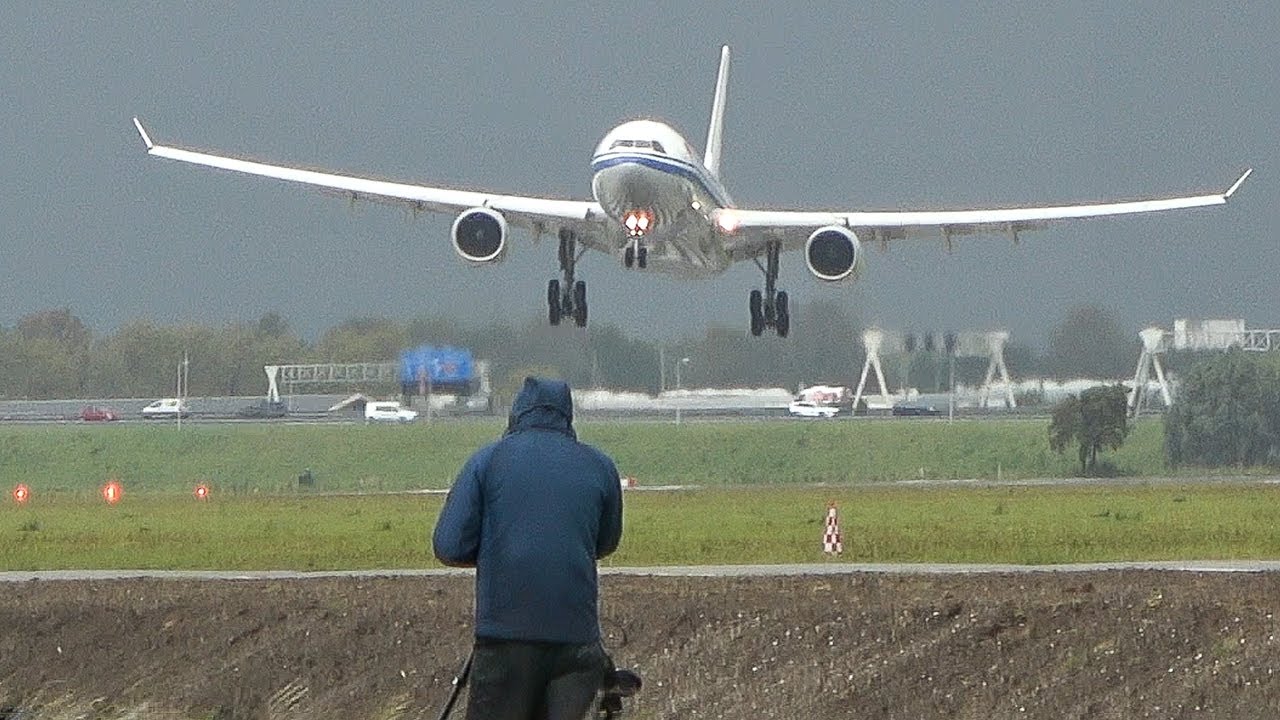 CROSSWIND LANDINGS during a STORM at AMSTERDAM - BOEING 747 Go Around, A380, A330 & more (4K)