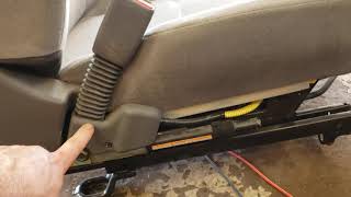 Seatbelt buckle tensioner activation