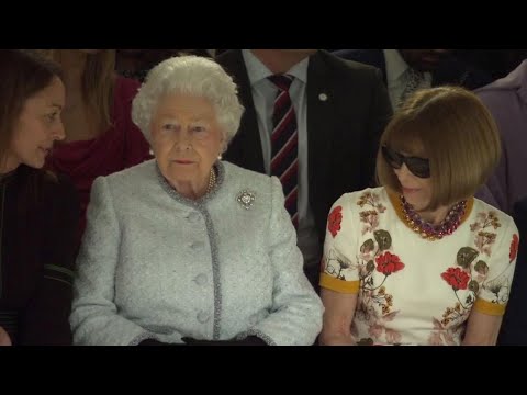 Queen Elizabeth II Takes in Fashion Show with Anna Wintour