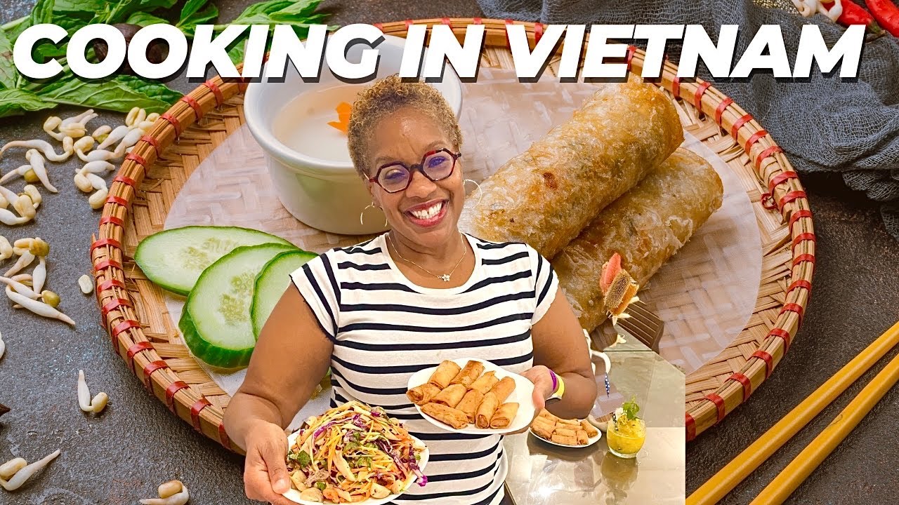 A tourist participates in a hands-on cooking class in Da Nang, learning to prepare authentic Vietnamese dishes.