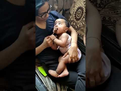 shrisha eating ice-cream for first time.