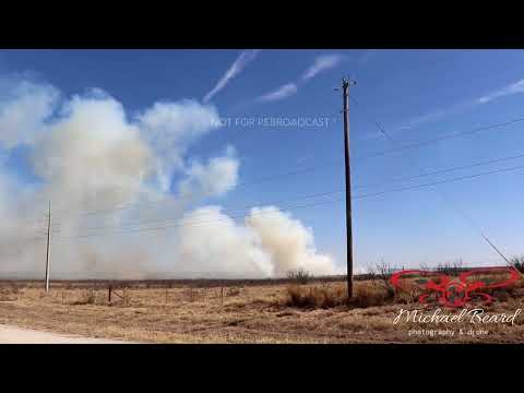 03-13-2022 Archer County, TX - Farmer watches as flames & smoke move closer to his cows.