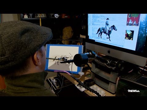 Paralyzed painter uses his mouth to create art