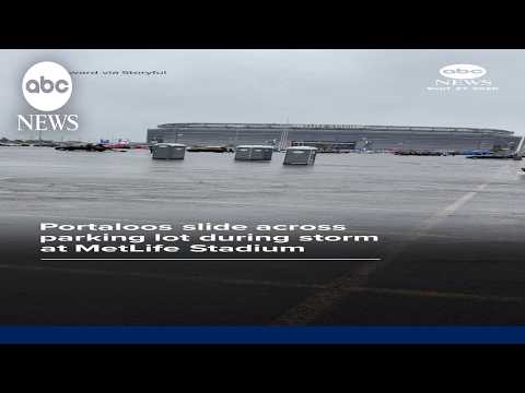 Portaloos slide across parking lot during storm at MetLife Stadium
