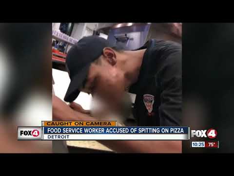 Worker caught on camera spitting on pizza