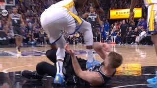 Draymond Green ejected for stepping on Domantas Sabonis after he grabbed his leg