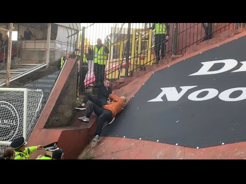 Dundee United fans and Celtic fans fighting