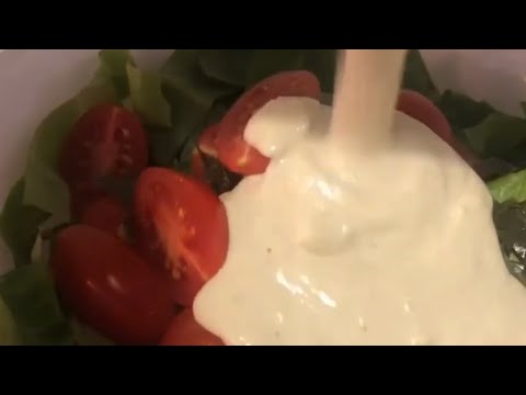 Caesar salad dressing recipe. Salad dressing with yogurt, mustard, oil, anchovies, Parmesan.