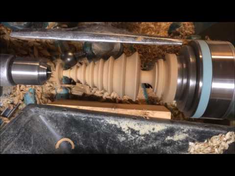 Hand woodturning a Xmas tree ornament.