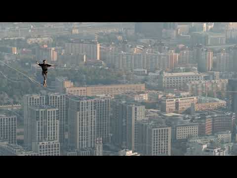 Slackline world record in Moscow, Guinness world record. A man balances on tight rope, a view of the