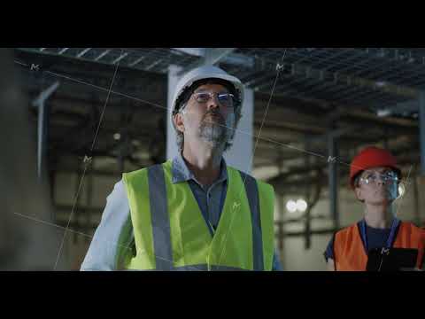 Engineer talking to assistant during power plant inspection