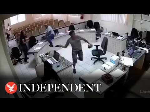 Moment son shoots father's accused killer six times in middle of courtroom caught on CCTV