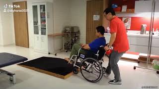 how to push a wheelchair up and down a step