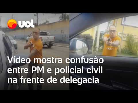 A police officer shoots at a police car during an argument outside a police station; video shows ...