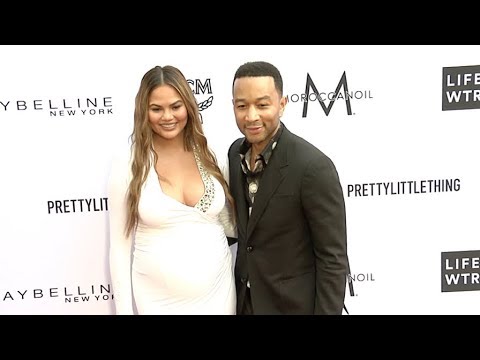 Chrissy Teigen and John Legend at Daily Front Row Fashion Awards red carpet