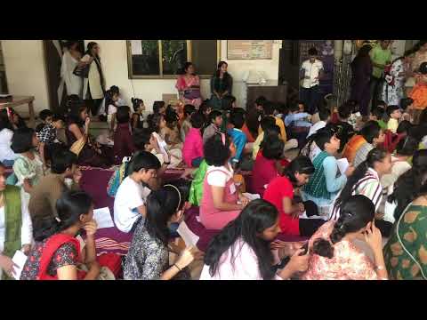 Sumedha sitting wd kids taking part in the Gita chanting competition - chinmaya mission Dec 10 2022