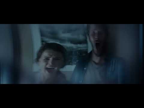 Dark Skies trailer frame: night exterior of a typical American suburban street under a starless sky