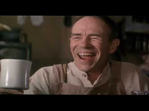 Trailer still: moonlit brook and two young lovers; strings and woodwinds hush to a glow