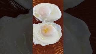 Should over easy eggs be flipped once or twice?