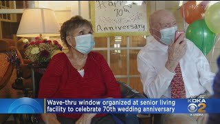 Local Couple Celebrates 70th Wedding Anniversary Through Window