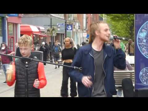 RICO (11) JOINS UNCLE RYAN AND DAD, CHRIS, OF RUFF TRADE, BUSKING REGGAE IN MANCHESTER    04/05/2023