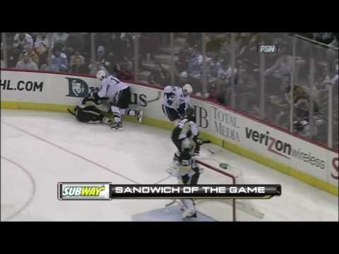 Rob Scuderi and Ryan Malone handing out checks