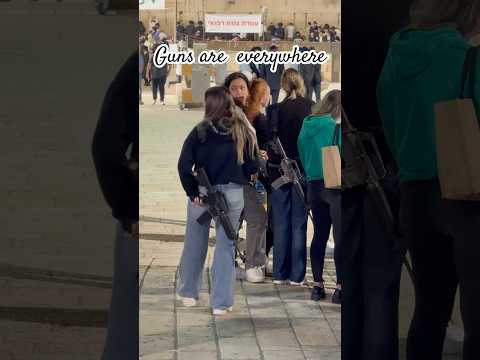 Why do most Israeli girls carry guns inside Jerusalem?