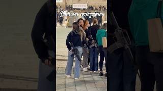 Why do most Israeli girls carry guns inside Jerusalem?