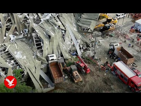 Workers buried under mountain of garbage after deadly landfill collapse