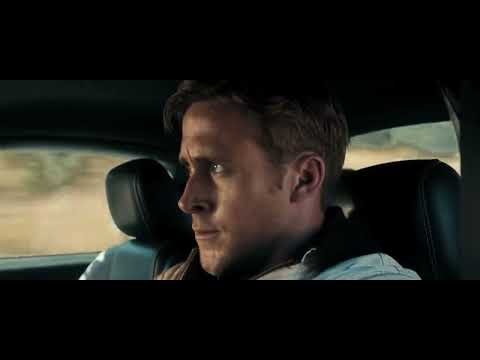 Drive (2011) official trailer still, neon-lit Los Angeles nightscape, soundtrack focus