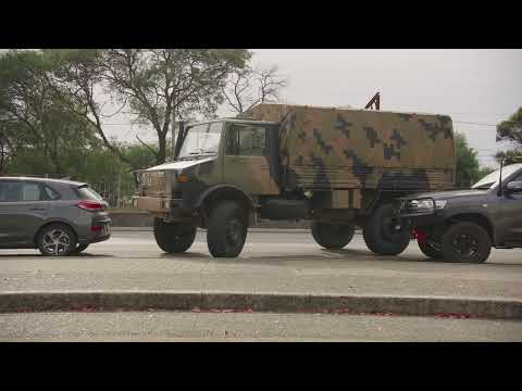 Australian Ex-Military Unimogs Attempt At Curb Side Park On Busy Street