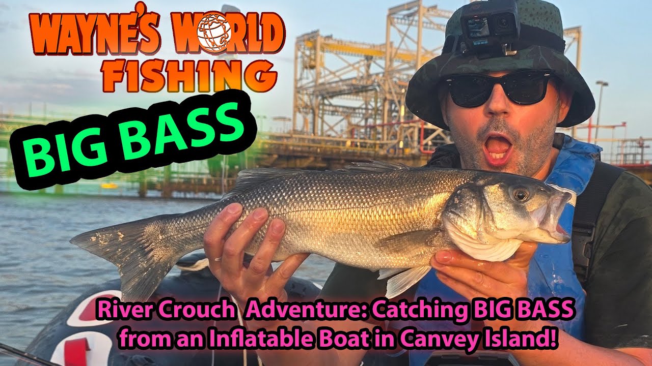 Man holds up his freshly caught personal best bass in front of the camera