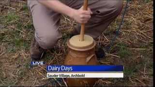 Reporter churns butter for Dairy Days