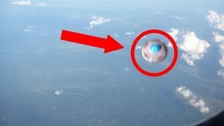 UFO SEEN BY PASSENGER ON AN AIRPLANE