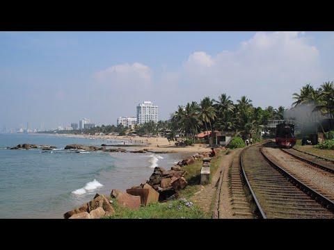 Sri Lanka steam locomotive B1A #251 at Navam full moon Poya Day on the coastal line in Mount Lavinia