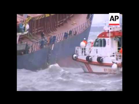 A cargo ship struggled to pump out water that seeped in through cracks after it brushed against two