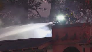 Crews working to put out large fire at College Park apartment