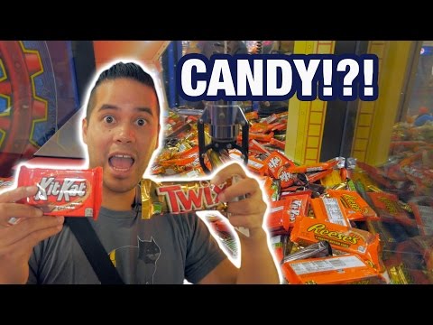 Sweet candy claw machine wins at Boomers! | The Crane Couple - YouTube