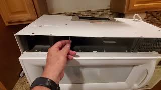 Removing stuck OTR microwave - hidden latch