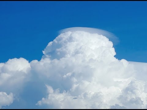 Time lapse of rising cumulus congestus V - pileus fomation