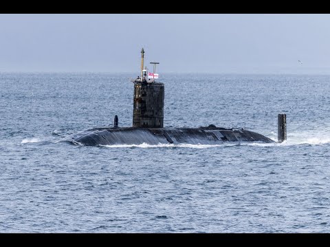 Royal Navy submarine HMS Triumph saling out the Clyde Estuary