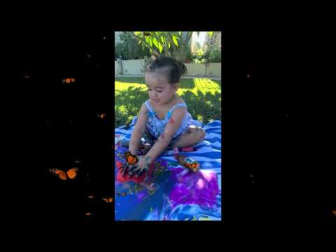 Analicia painting with blue, yellow, and red