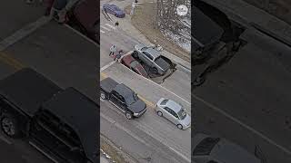 Omaha traffic camera captures sinkhole swallowing two vehicles in Nebraska