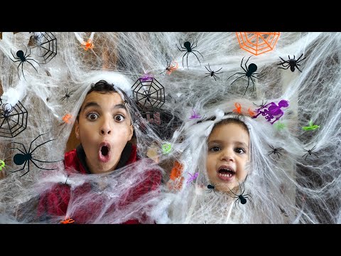 Sam and Amira pretend to play Halloween Trick or Treat in the children's haunted houses