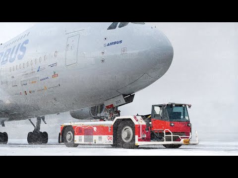 The Insane Amount of Power Pushback Trucks Pack to Move Giant Aircraft