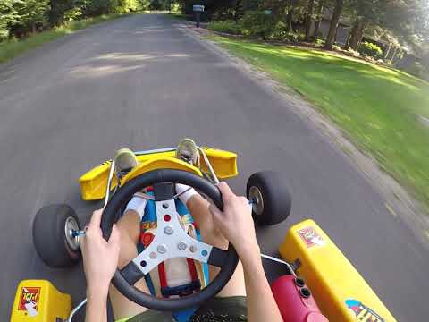 Kt100 racing go kart driving though neighborhood