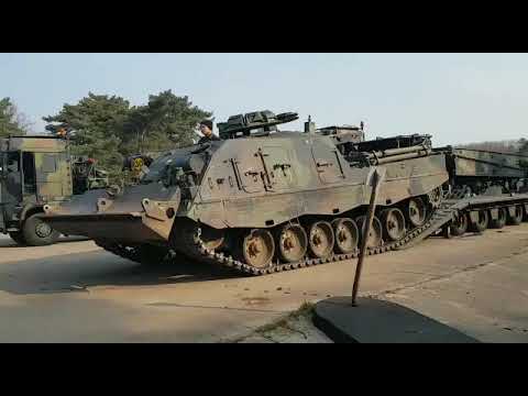 Leopard 2 Buffel Armoured Recovery vehicle drives onto an trailer.