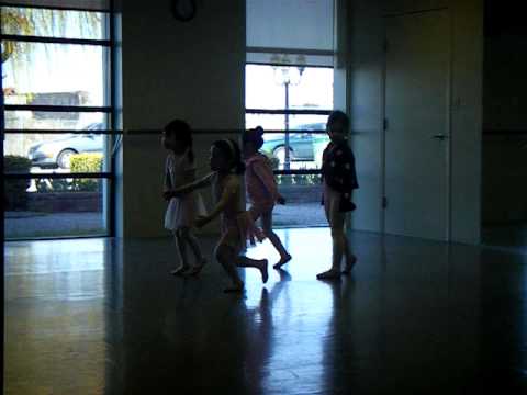 Very young ladies (only 3 - 4 yrs. old) dancing @ the studio with their teacher