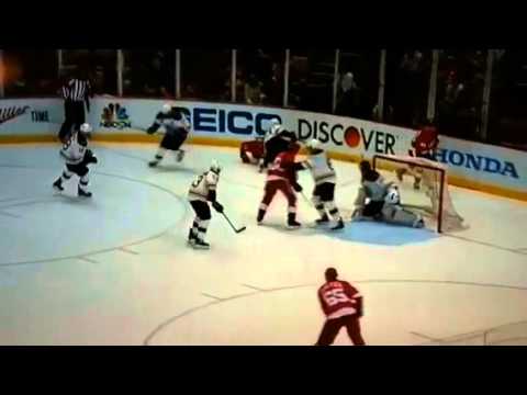 Boston Bruins' Brad Marchand viciously slashes Drew Miller in the nuts.