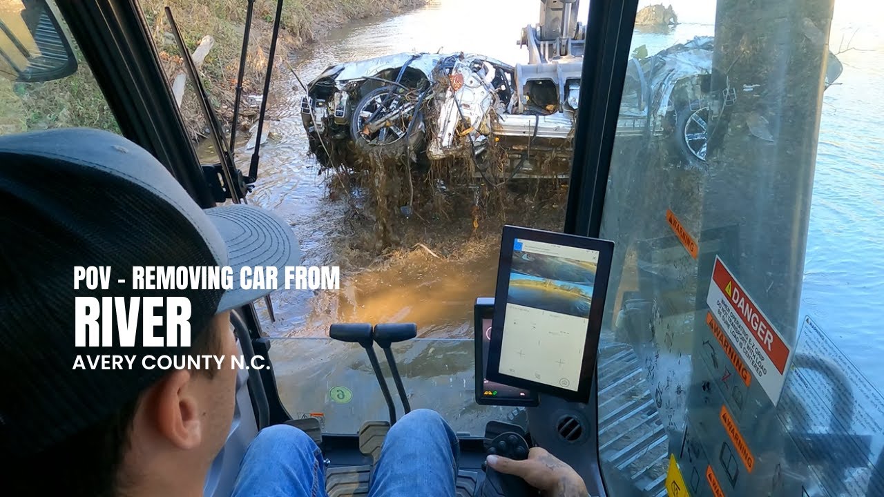 POV - pulling a car out of the river in N.C. after the Hurricane
